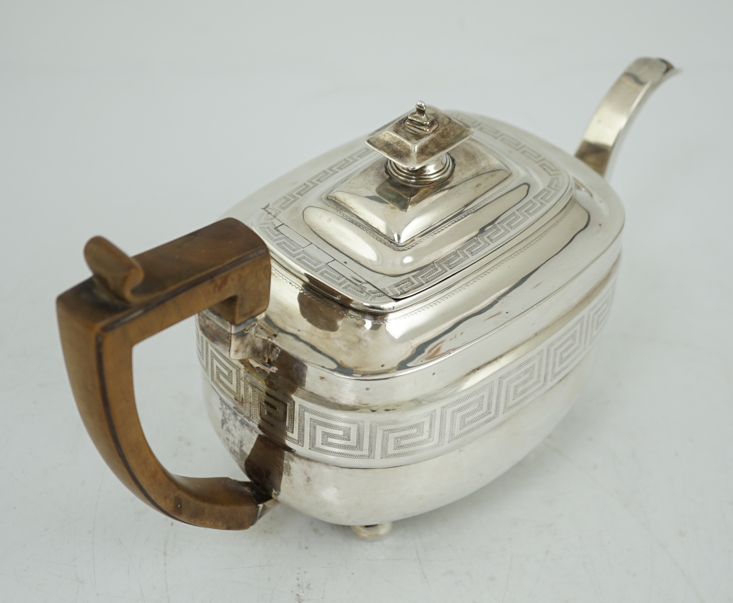 A George III silver shaped rectangular teapot, by Soloman Hougham,`